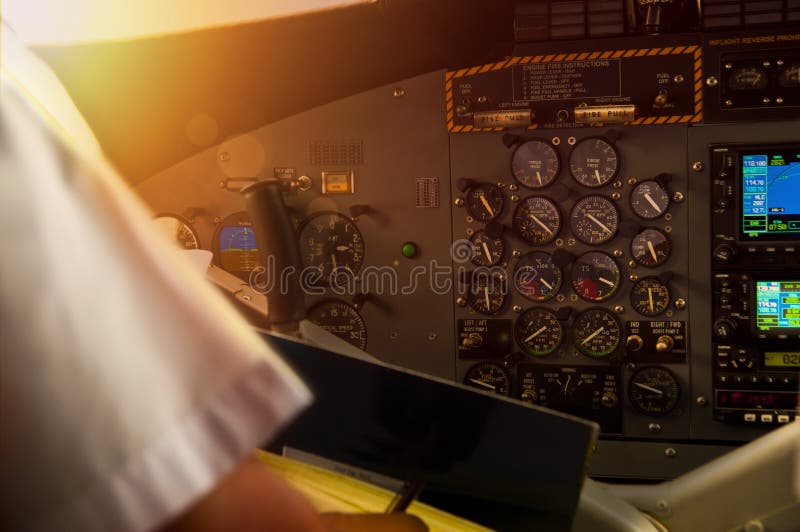 Cockpit of a Propeller Plane in Flight during Sunset Stock Image