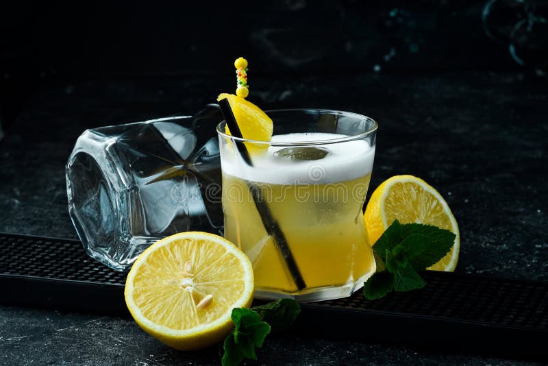Cocktail. Alcoholic Cocktail with Lemon Liqueur and Lemon Peel in a