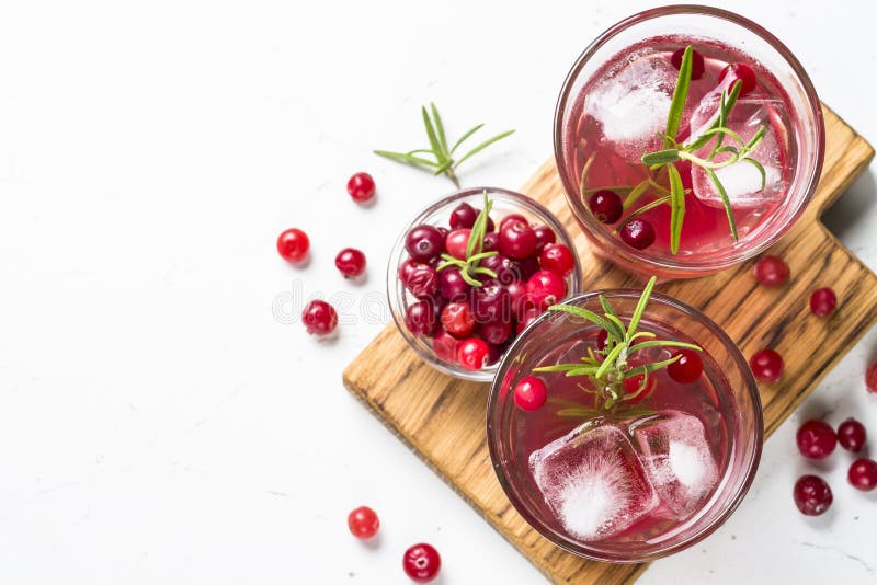 Cocktail with Cranberry, Vodka, Rosemary and Ice. Stock Photo Image