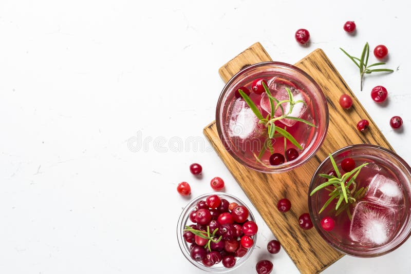 Cocktail with Cranberry, Vodka, Rosemary and Ice. Stock Photo Image