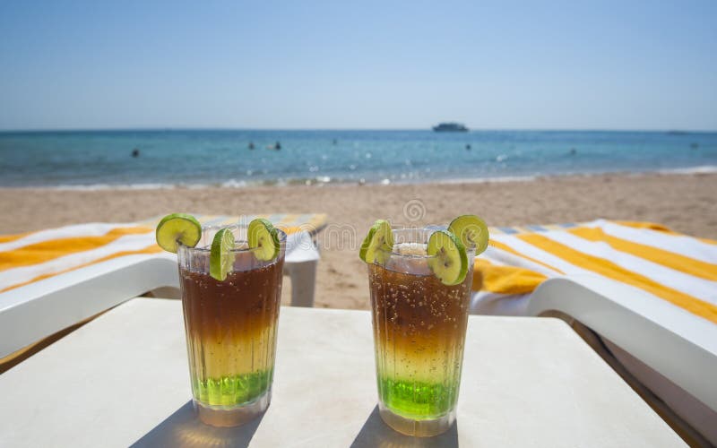 Cocktail drinks on beach at luxury tropical hotel beach