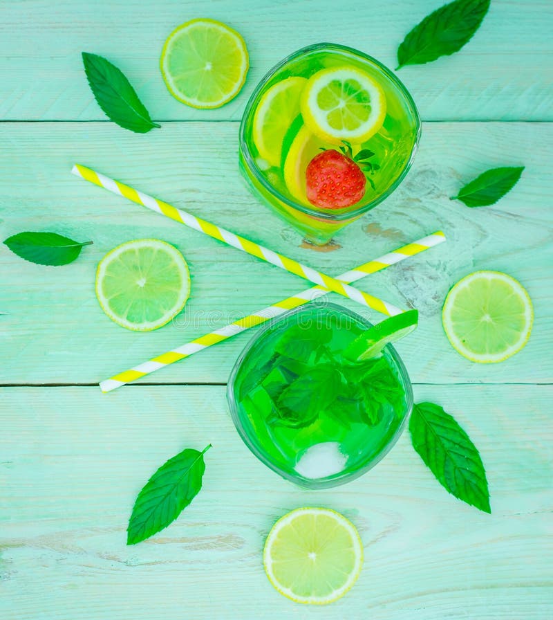 Cocktail with lemon and lime with fresh green mint