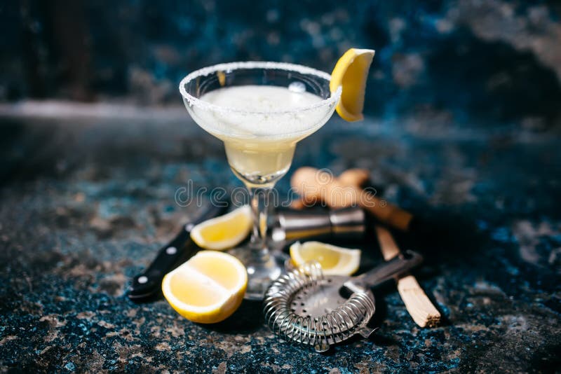 Cocktail with lemons and vodka. Margarita refreshment drink and cocktails