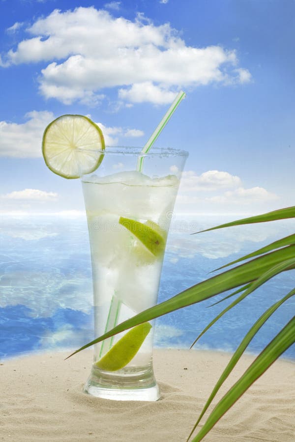 Exotic and tropical landscape with lime drink on beach. Exotic and tropical landscape with lime drink on beach