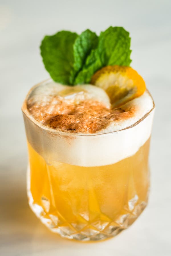 Cocktail with Orange Bitter and Orange Peel and Mint Leave Stock Image