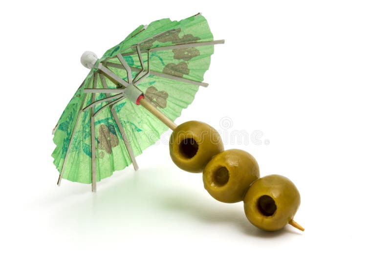 Cocktail umbrella and olives.
