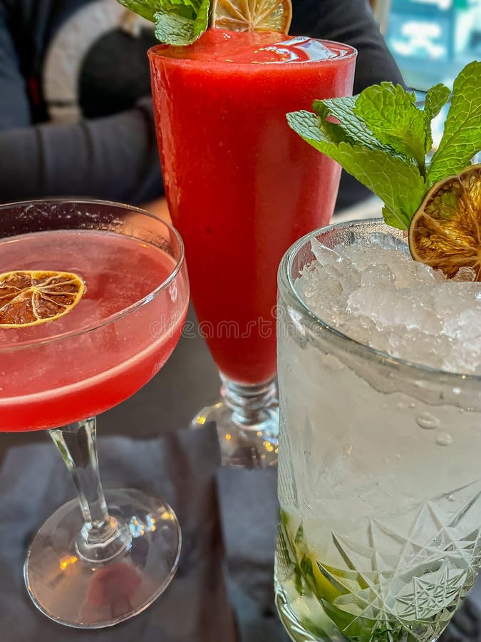 Cocktails Collection Drinks on Bar, Red Color an Melisse Editorial