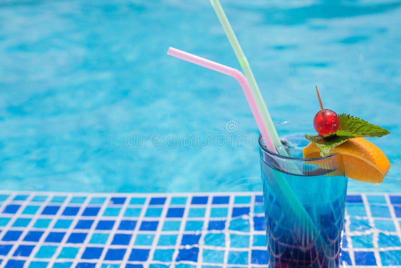 Cocktails by the pool stock image. Image of liquid, beach 168407925