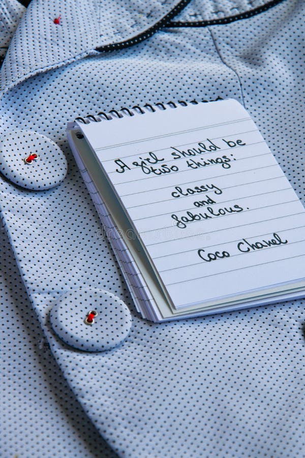 Coco Chanel Quotes Written on a Block Note, Pearl Accessories and an Silky  Flower Shirt Stock Image - Image of note, background: 132010577