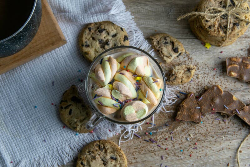 Cocoa with Marshmallows and Chocolate Oven and Slices of Chocolate