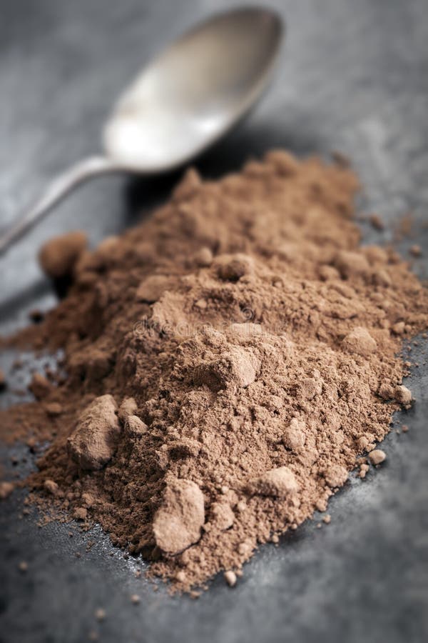 Cocoa Powder with Spoon royalty free stock images