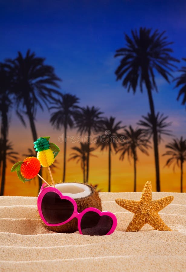 Coconut cocktail on tropical sand beach heart sunglasses stock images Coconut cocktail on tropical sand beach heart sunglasses stock images