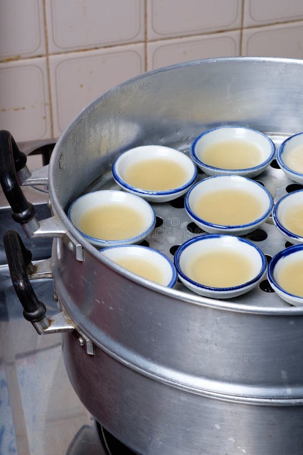 Coconut Milk Custard in Small Porcelain Cup (Thai Dessert) Stock Photo