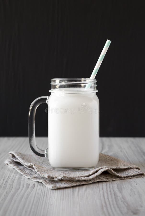 Coconut Milk in a Glass Jar, Side View. Closeup Stock Image Image of