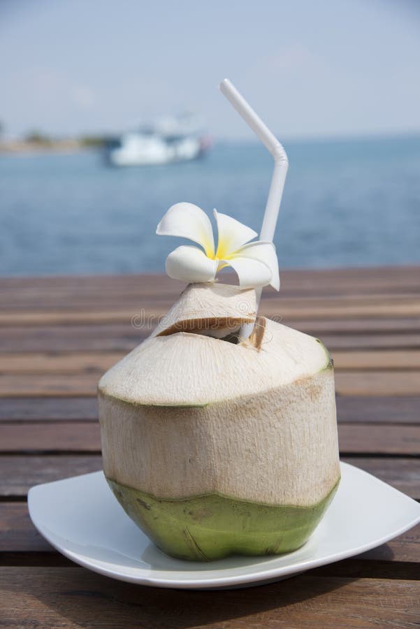 Coconut placed on a wooden board background stock photos
