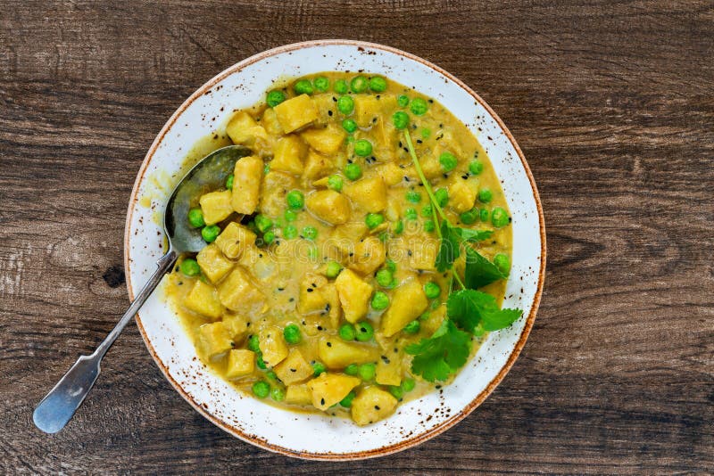 Coconut and potato curry stock photo. Image of meal - 277171156