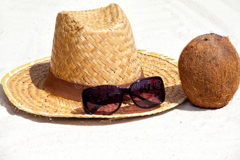 Coconut and Straw Hat on the Beach Stock Image - Image of coconut