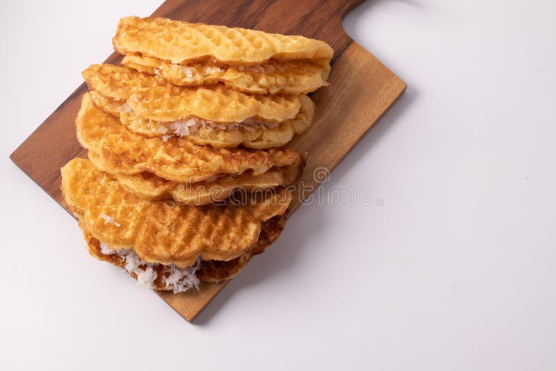 Coconut Waffle on a Wooden Cutting Board, White Background Stock Image