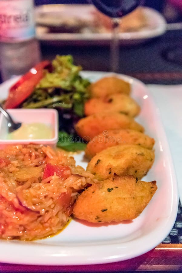 Cod Cakes Served in a Restaurant in Lisbon, Portugal Stock Image