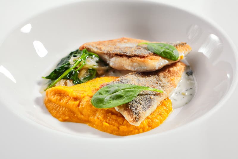 Cod fillet with pumpkin puree and spinach