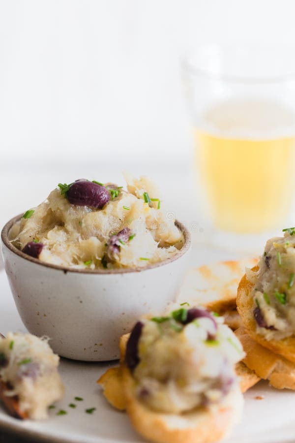 Cod Fish Brandade on a White Ceramic and Rustic Napkin Stock Photo