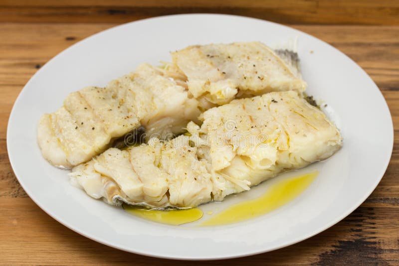 Cod fish with olive oil stock photo. Image of seafood 63702062
