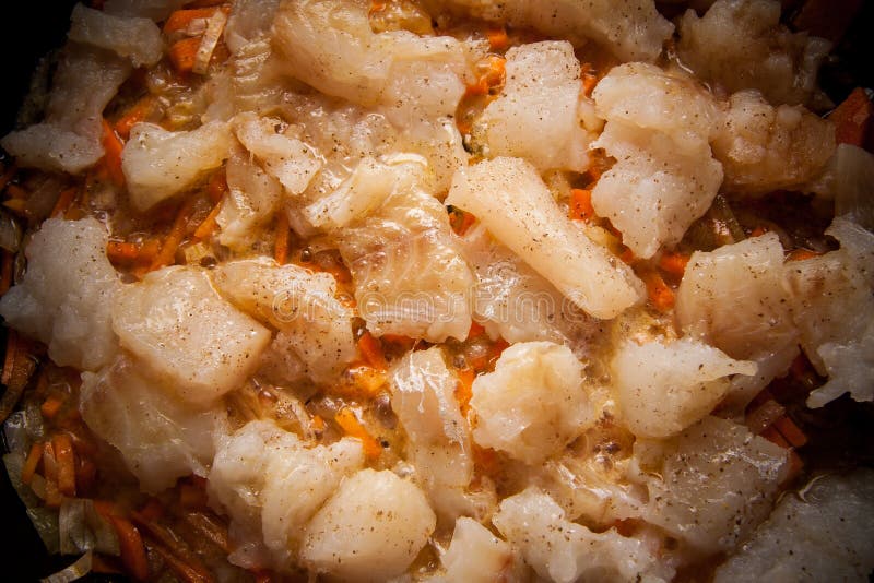 Cod pieces on pan stock photo. Image of onion, food, steaks 60057196
