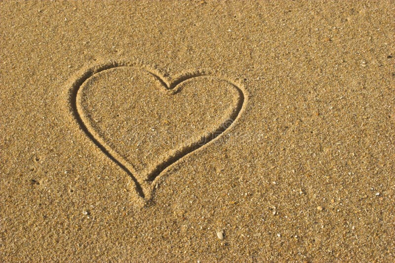 Picture of a Love message on a gold sand. Picture of a Love message on a gold sand