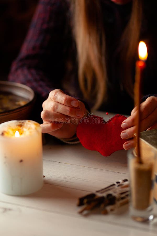 Red heart in hands of witch, love spell and broken heart, unrequited love. Psychic vision, fortune teller. Red heart in hands of witch, love spell and broken heart, unrequited love. Psychic vision, fortune teller.