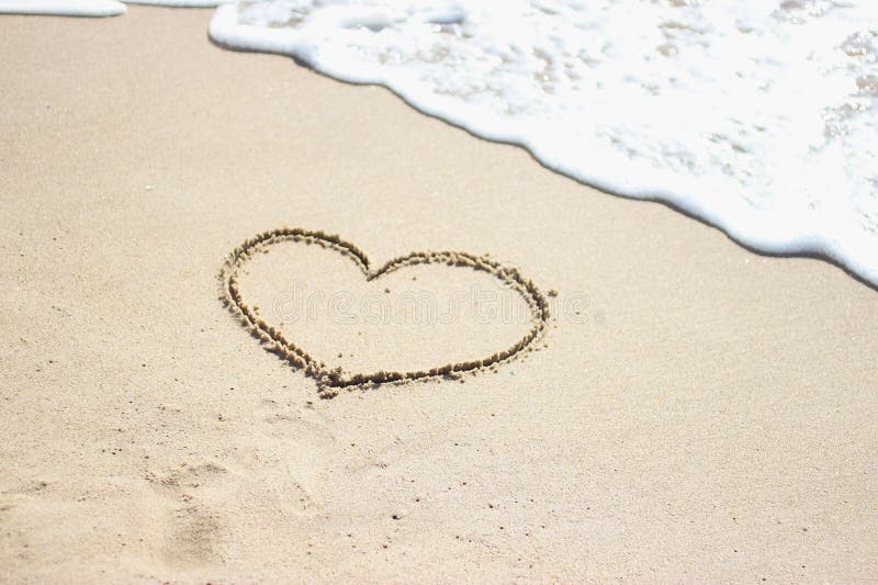 Heart drawn on the sand of a sea beach, soft wave, seacost, love shape. Heart drawn on the sand of a sea beach, soft wave, seacost, love shape