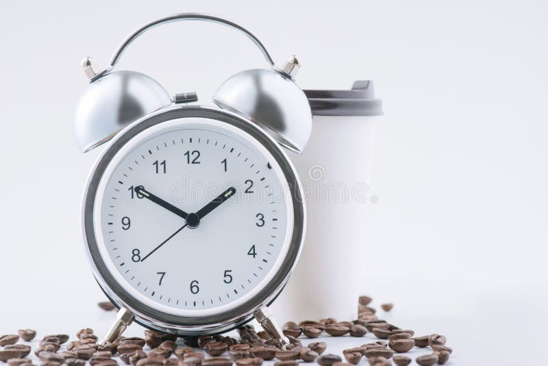 Coffee and alarm clock waiting together