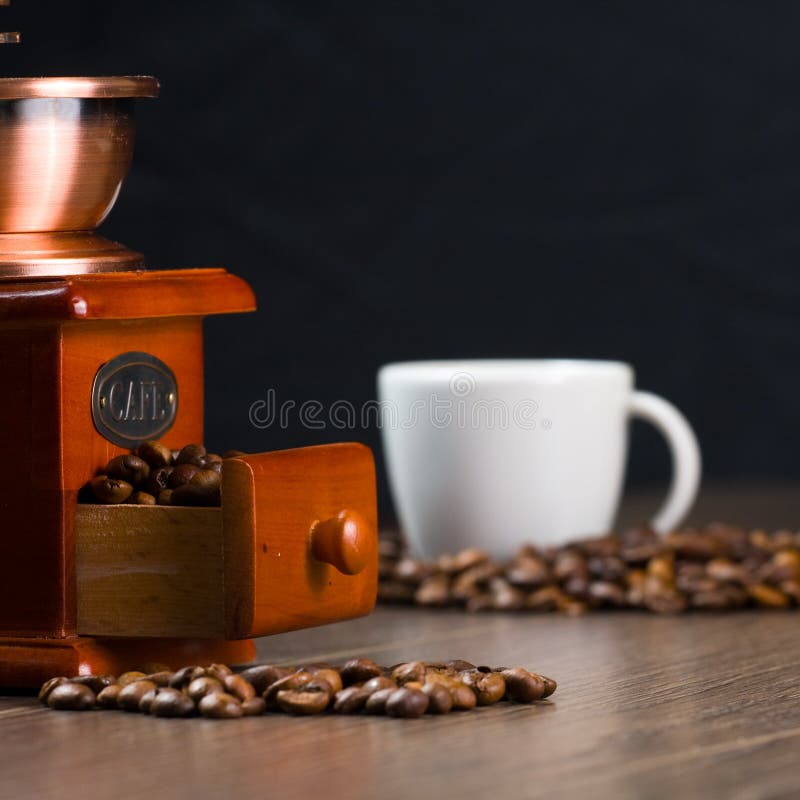 Coffee Antique Grinder, Coffee Beans and Cup of Coffee. Stock Image