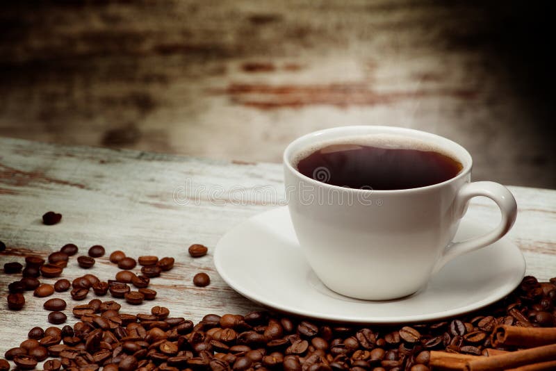 Cup of Coffee Surrounded by Coffee Beans. Top View Stock Photo Image