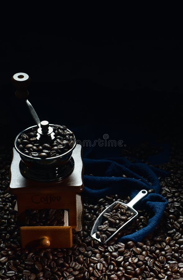 Coffee Background of Roasted Coffee Beans with Coffee Grinder and Scoop
