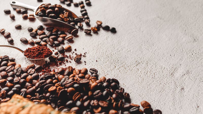 Coffee beans in a brown sack.Coffee beans in the stainless steel scoop and coffee powder on a wooden spoon on white background