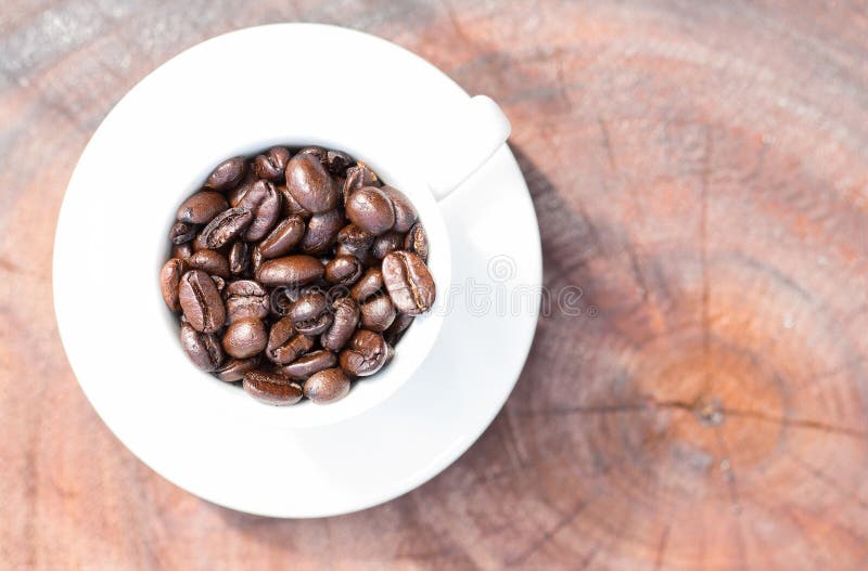 Coffee beans in coffee cup stock image. Image of drink 48535863