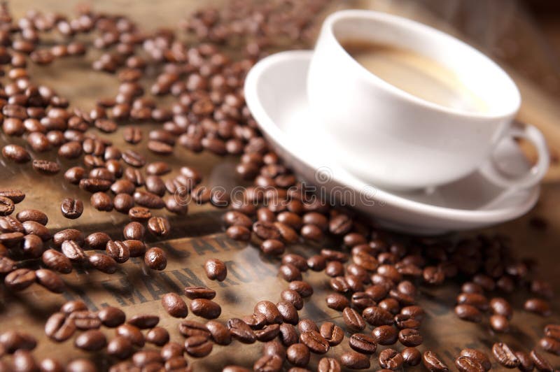Coffee Beans and Cup in Relaxed Atmosphere, Warm Colors and Soft Stock