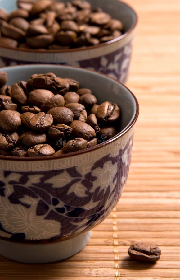 Coffee beans in the cups stock photo. Image of cappuccino 2494394