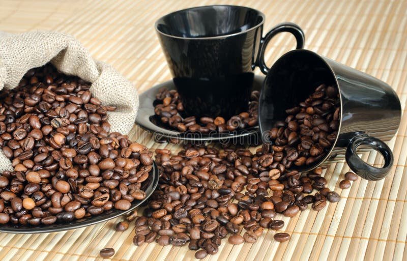 Coffee beans with cups and sack