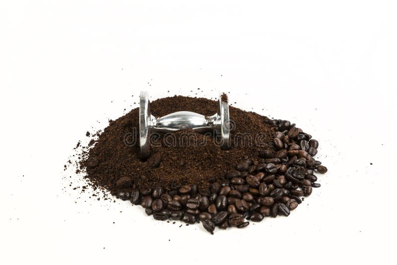 Coffee Beans and Grounds by an Espresso Tamper Laying in the Pile Stock