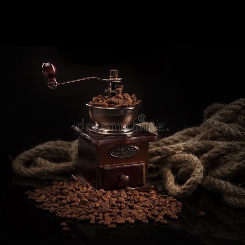 Coffee beans with coffee mill