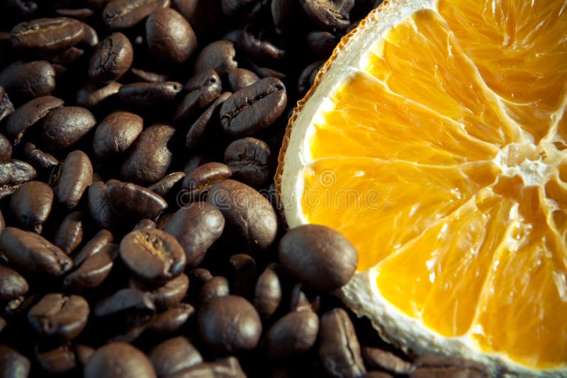 Coffee beans with orange stock image. Image of dark