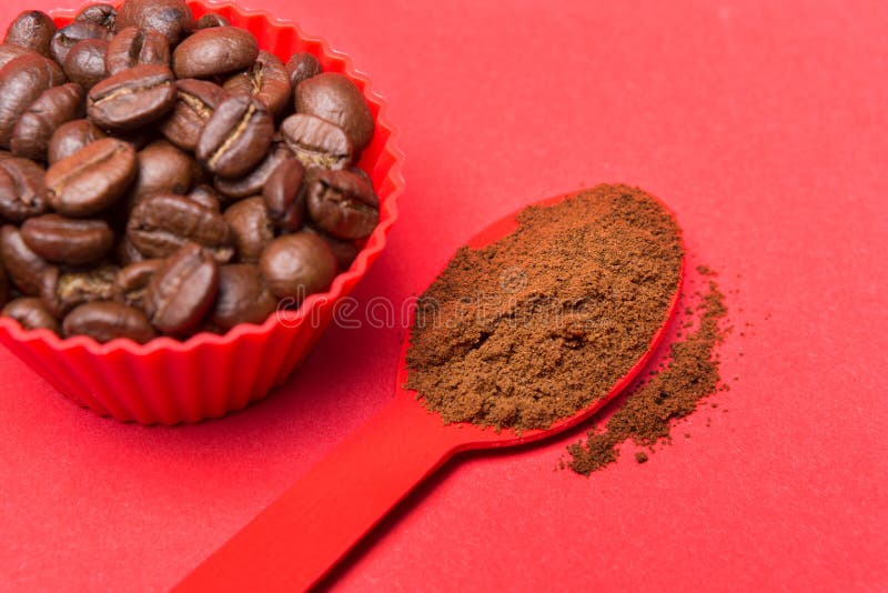 Coffee Beans in a Red Container on a Red Background, Powdered Ground
