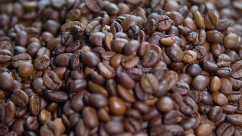 Coffee beans on rotating table, close up shoot stock video