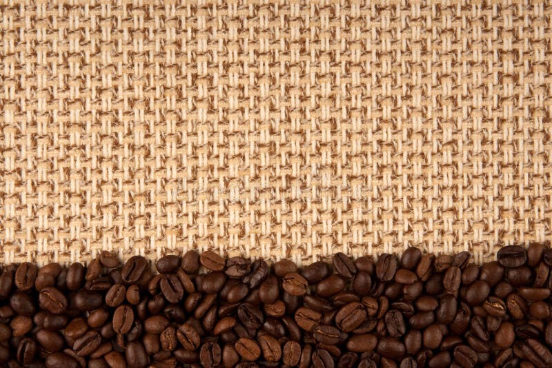 Coffee beans and sackcloth background