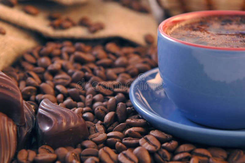 Coffee beans, sugar and cup