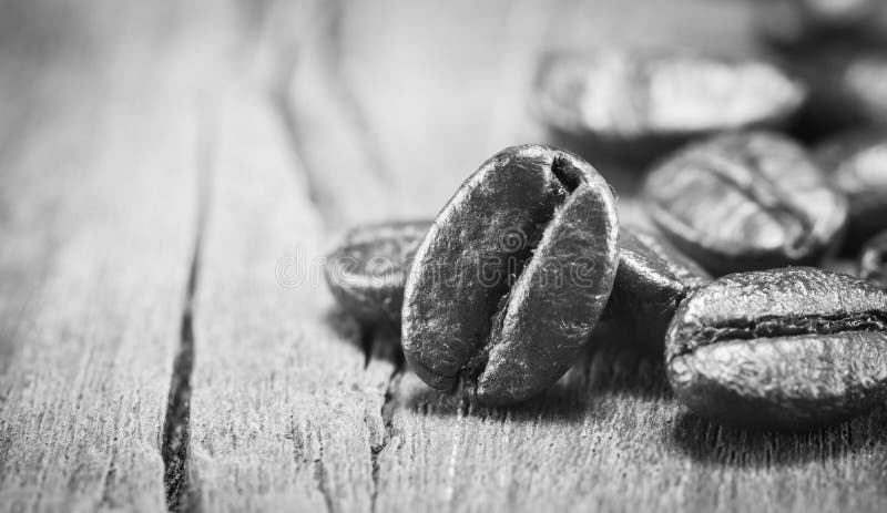 Coffee Beans texture on black and white on the wood background