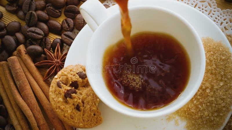 Coffee being poured into coffee cup. Slow Motion. Hot cafe video