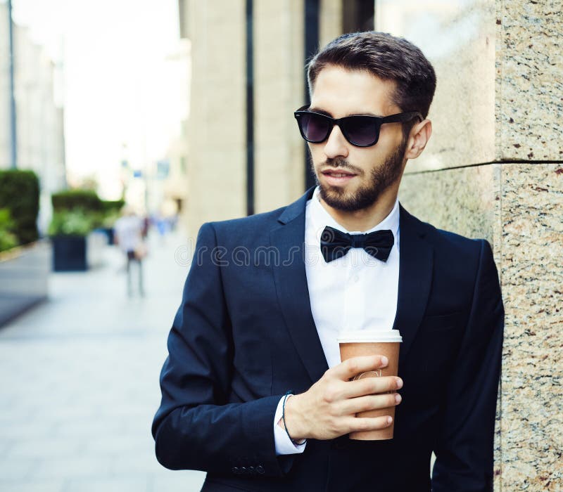 Coffee Break. Businessman In A Business Suit And A Glass Of Coffee In A City, Business Center, Office Building. Summer