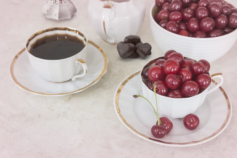 Coffee and Cherries in a Cup on the Table. Stock Image Image of